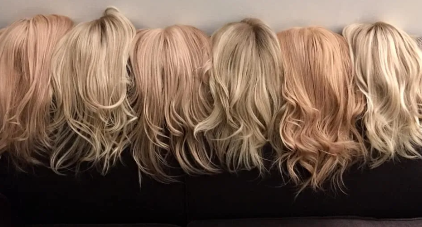 four hair toppers on display